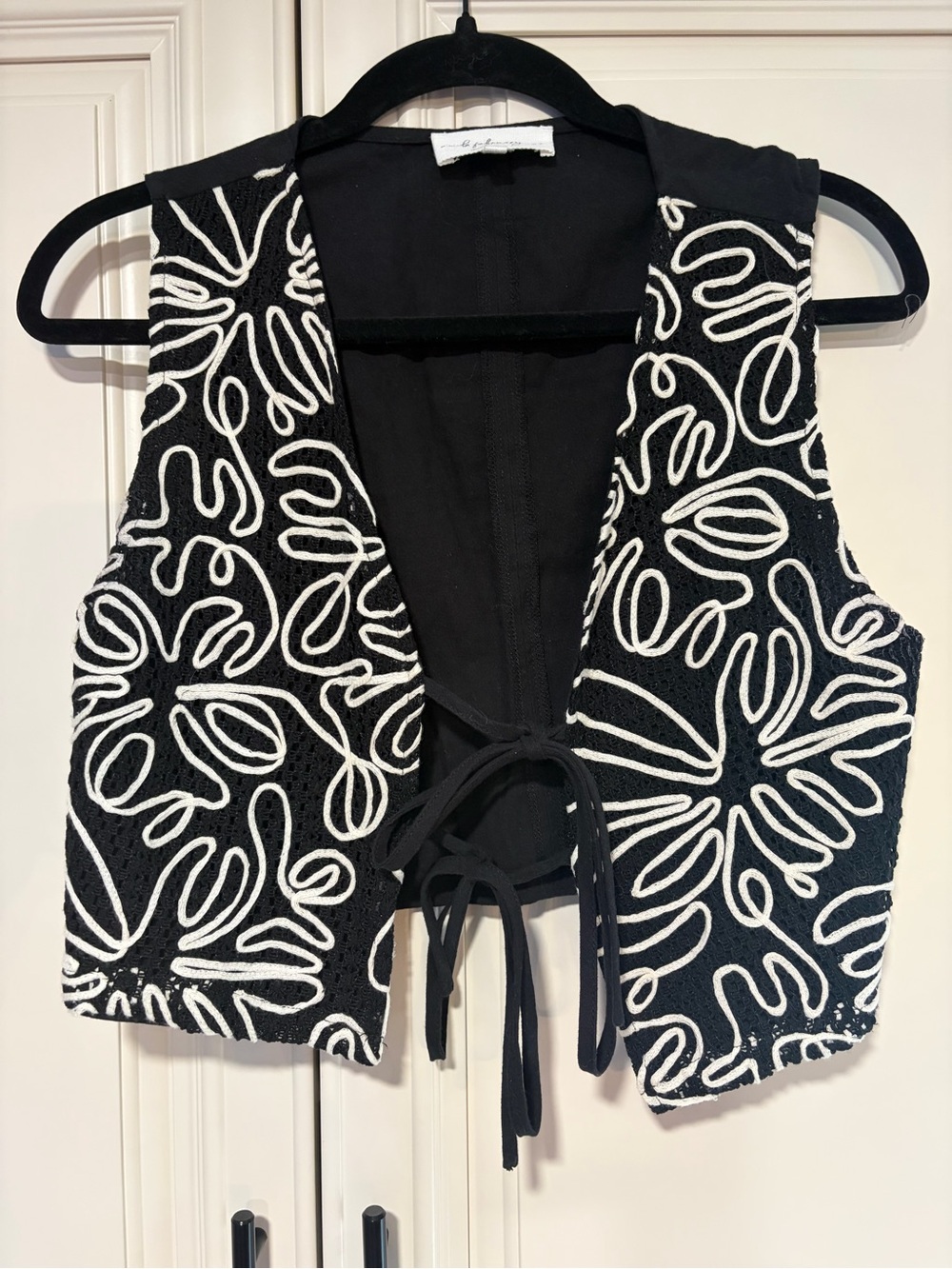 Black and white vest made by In February